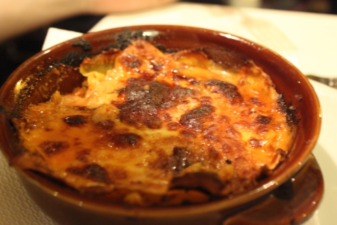 Lasagna served in terracotta tin